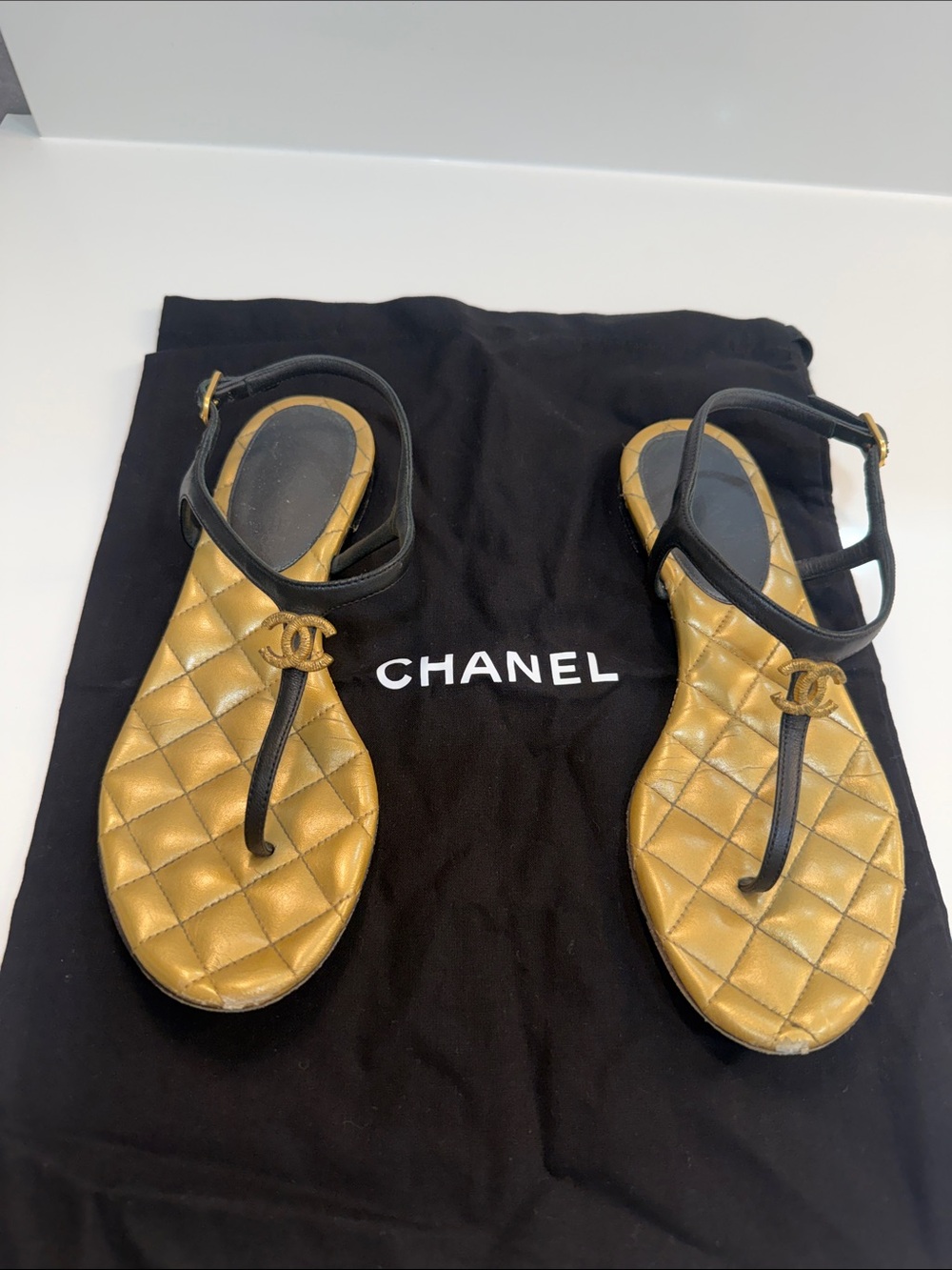CHANEL Gold Quilted Sandals with Black Straps